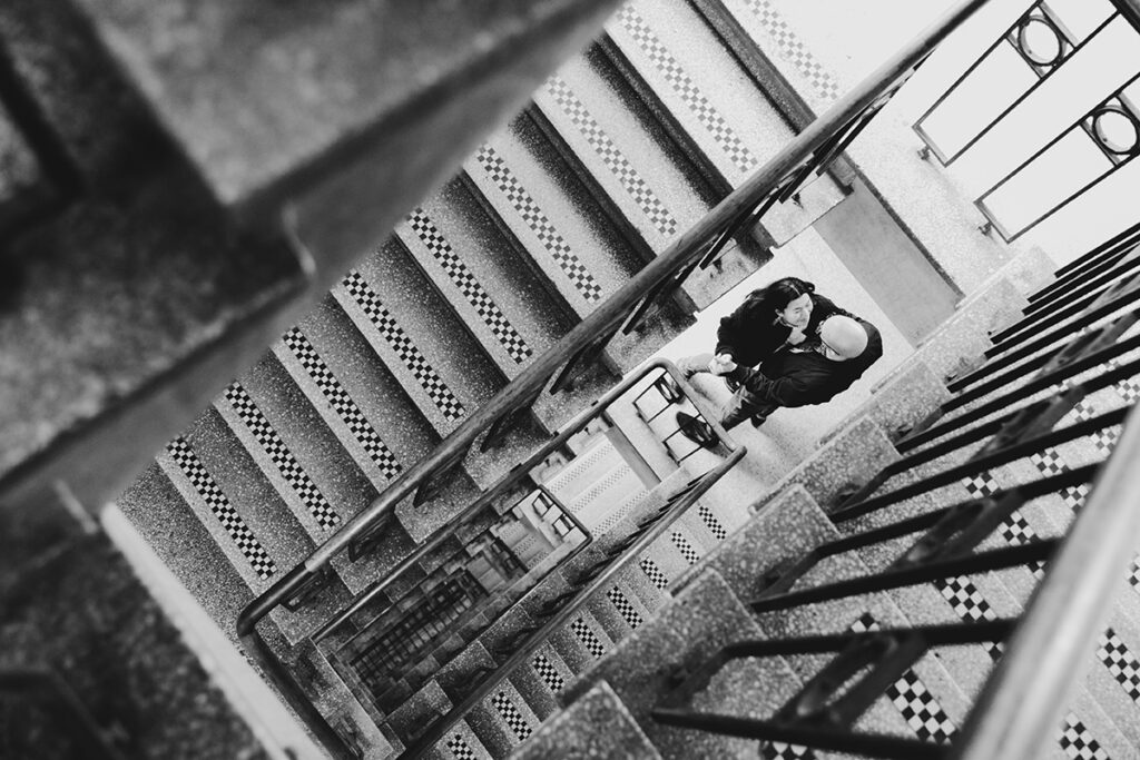 black and white image of a couple in Melbourne cuddling on a stairwell at an engagement session.
Engagement photo in Melbourne.
Dancing and laughing photo.