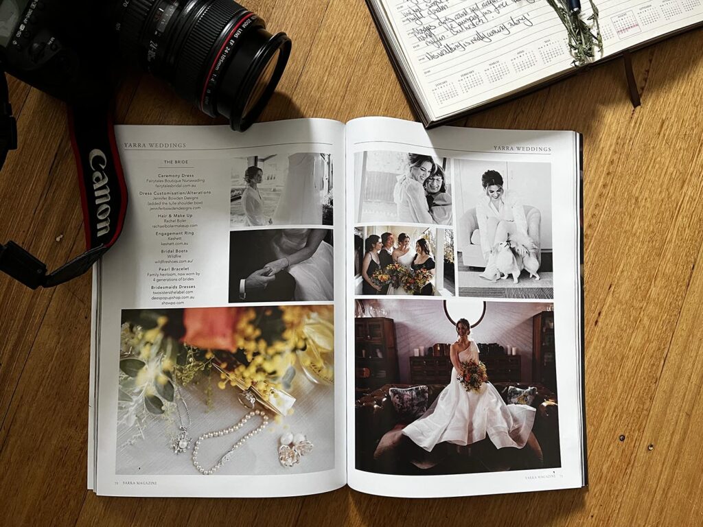 Layflat image of a magazine with a camera and diary in the background. Magazine article about Yarra Valley Weddings