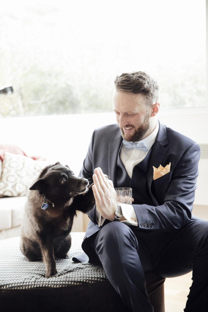 Groom sitting with his dog in Warburton