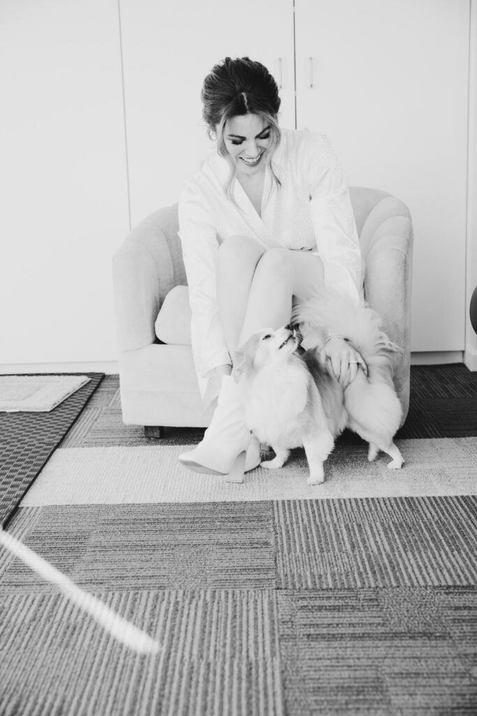 Bride getting ready with dogs for her winter wedding in Warburton