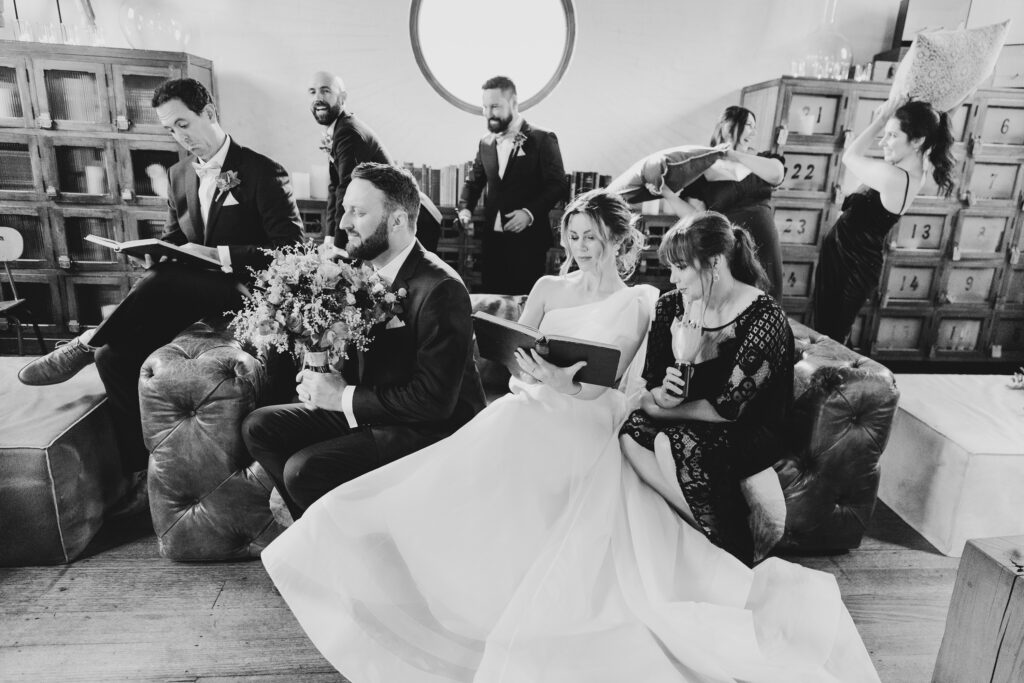Bridal party having fun at Projekt 3488 at the winter wedding in Warburton