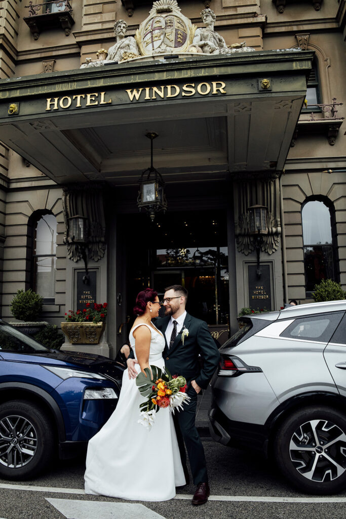 Bride and groom wedding photos outside the Hotel Windsor in Melbourne.