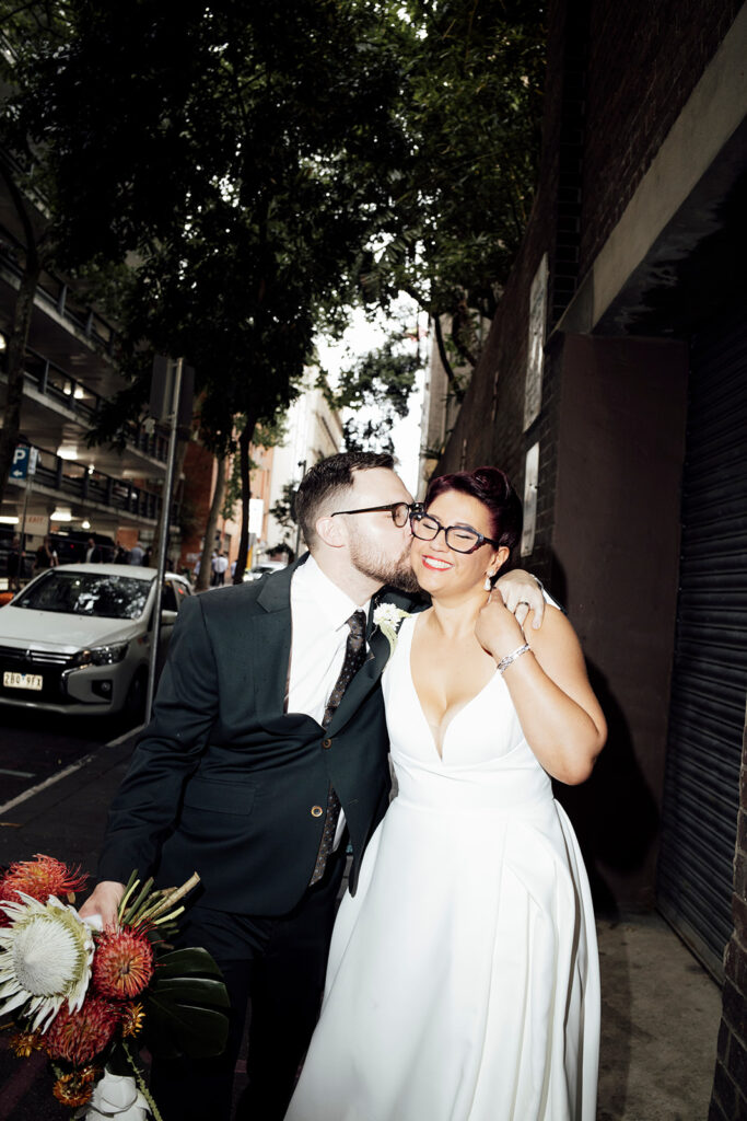 Bride and groom wedding photos outside the Hotel Windsor in Melbourne.