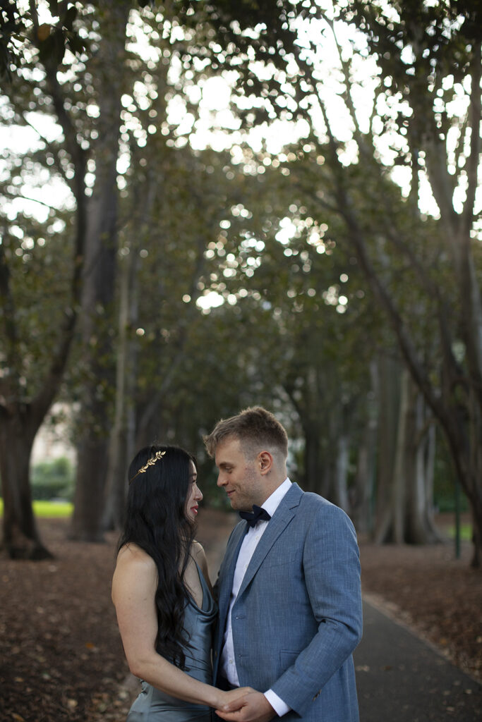 A Melbourne Elopement followed by a  Panama Dining Room Wedding. a Couple having wedding photos in Treasury gardens