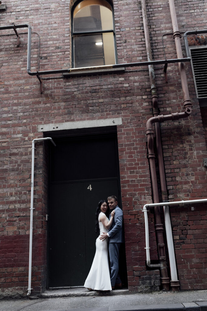 A Melbourne Elopement followed by a  Panama Dining Room Wedding. a Couple having wedding photos in down the laneways streets of Melbourne