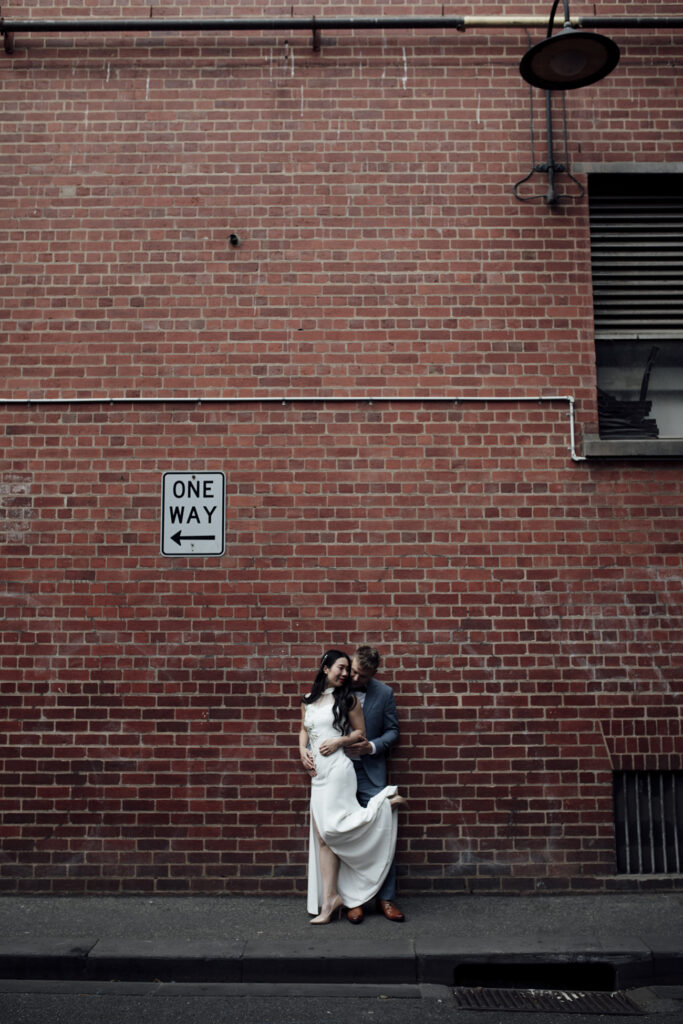 A Melbourne Elopement followed by a  Panama Dining Room Wedding. a Couple having wedding photos in down the laneways streets of Melbourne