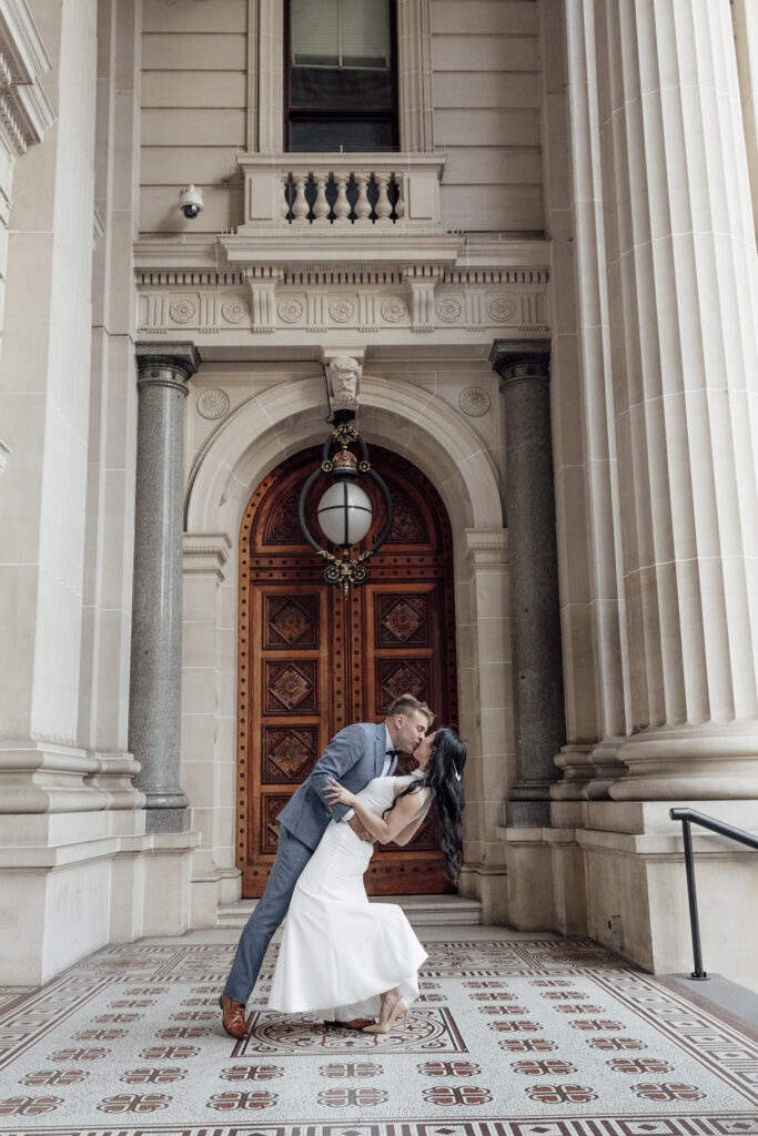 A couple having a Melbourne Elopement, dancing at Parliament Steps.