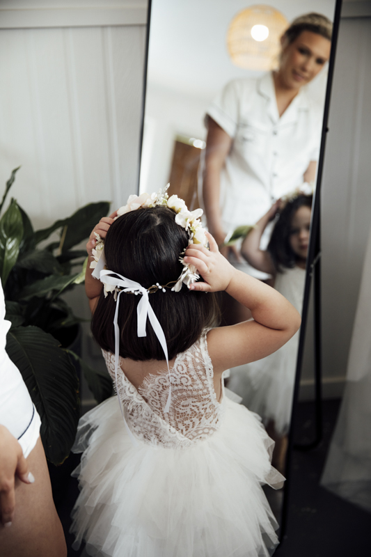 A colour image of a bride getting ready at Eight acres lakes entrance