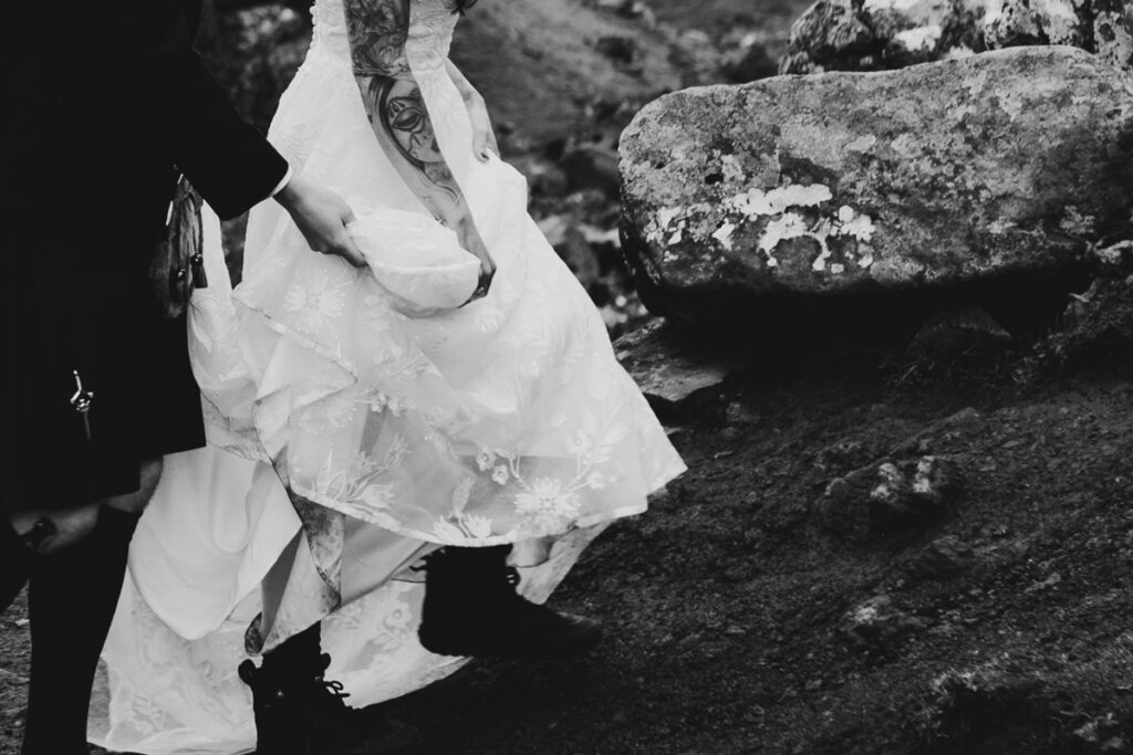 Scotland wedding photographer - a couple having wedding photos on the Old man of Storr