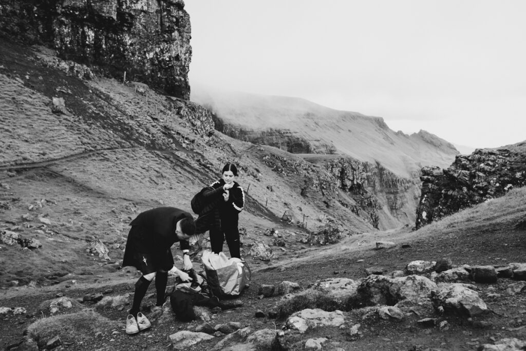 Scotland wedding photographer - a couple having wedding photos on the Old man of Storr