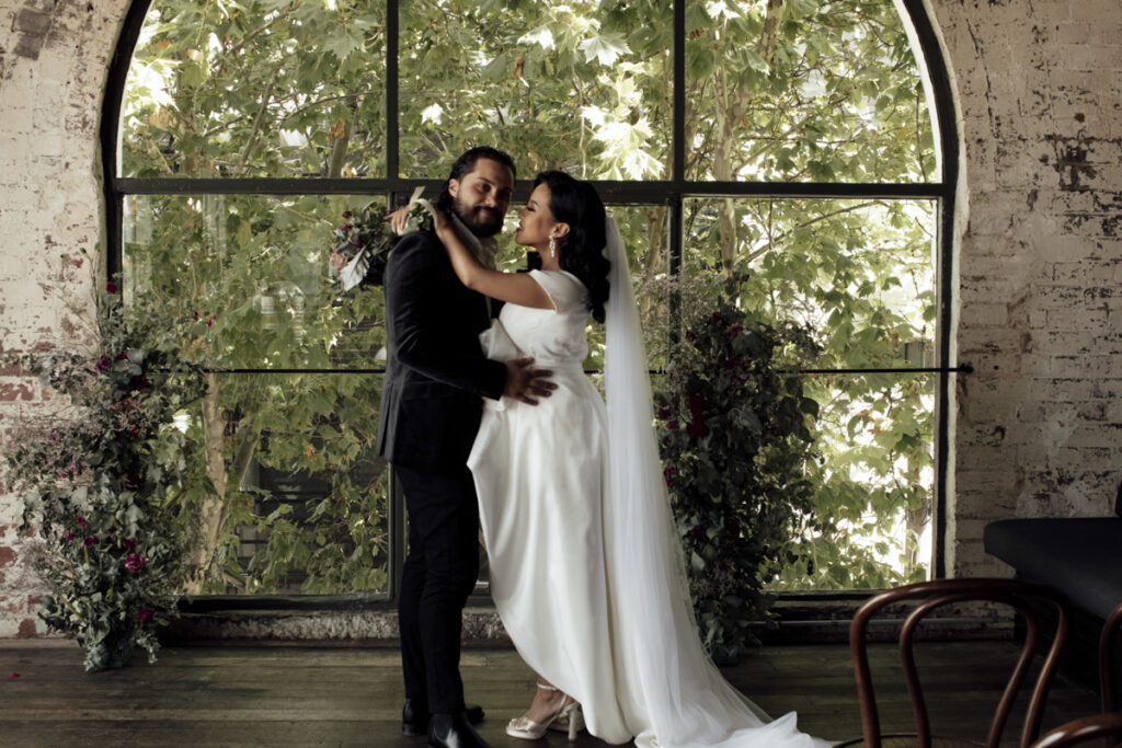 Panama Dining Room Melbourne wedding photography. A couple having their wedding photos taken in Panama Dining room, that are happy and laughing.