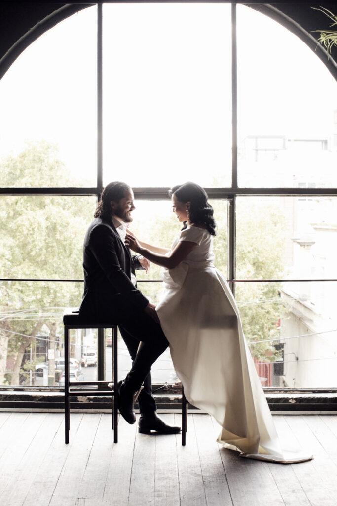 Panama Dining Room Melbourne wedding photography. A couple having their wedding photos taken in Panama Dining room, that are happy and laughing.