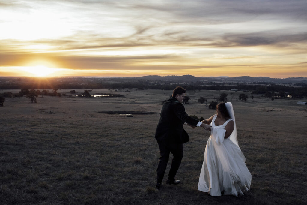 Paramoor Melbourne wedding photography. A couple having their wedding photos taken in Paramoor wineryl, that are happy and laughing.
