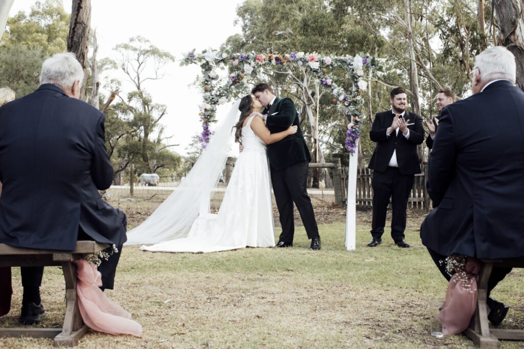 Paramoor Melbourne wedding photography. A couple having their wedding photos taken in Paramoor wineryl, that are happy and laughing.