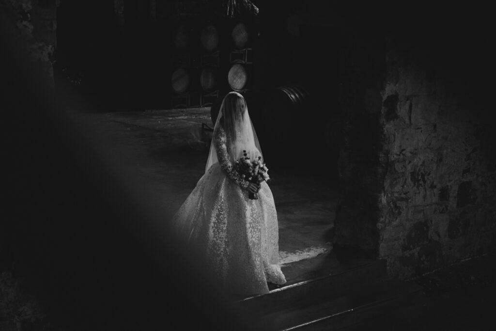 Provenance wedding photography. A couple having their wedding photos taken in Provenance in the grand Hall, that are happy and laughing.
