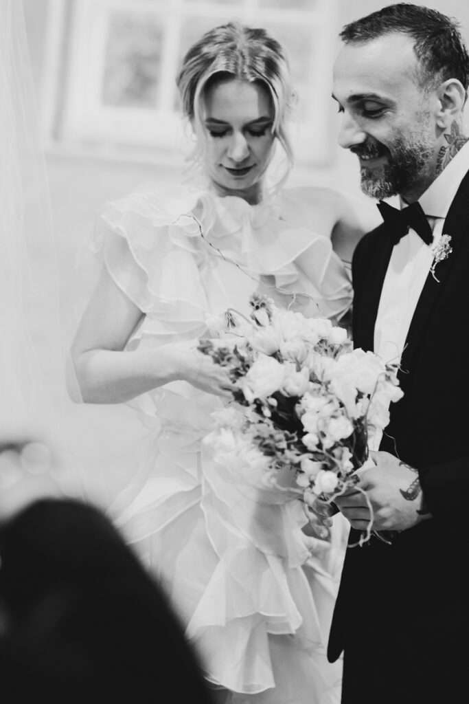 Provenance wedding photography. A couple having their wedding photos taken in Provenance in the grand Hall, that are happy and laughing.