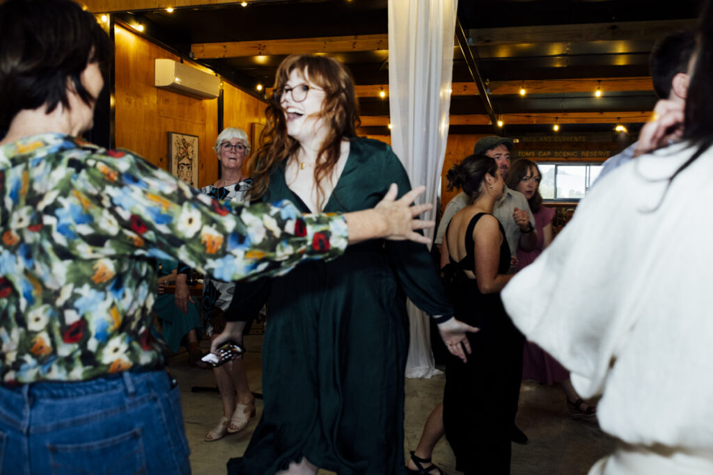 Gurney Cidery Wilsons Prom wedding photography. A couple having their wedding photos taken in Gurney Cidery, that are happy and laughing. Dancing on the dance floor