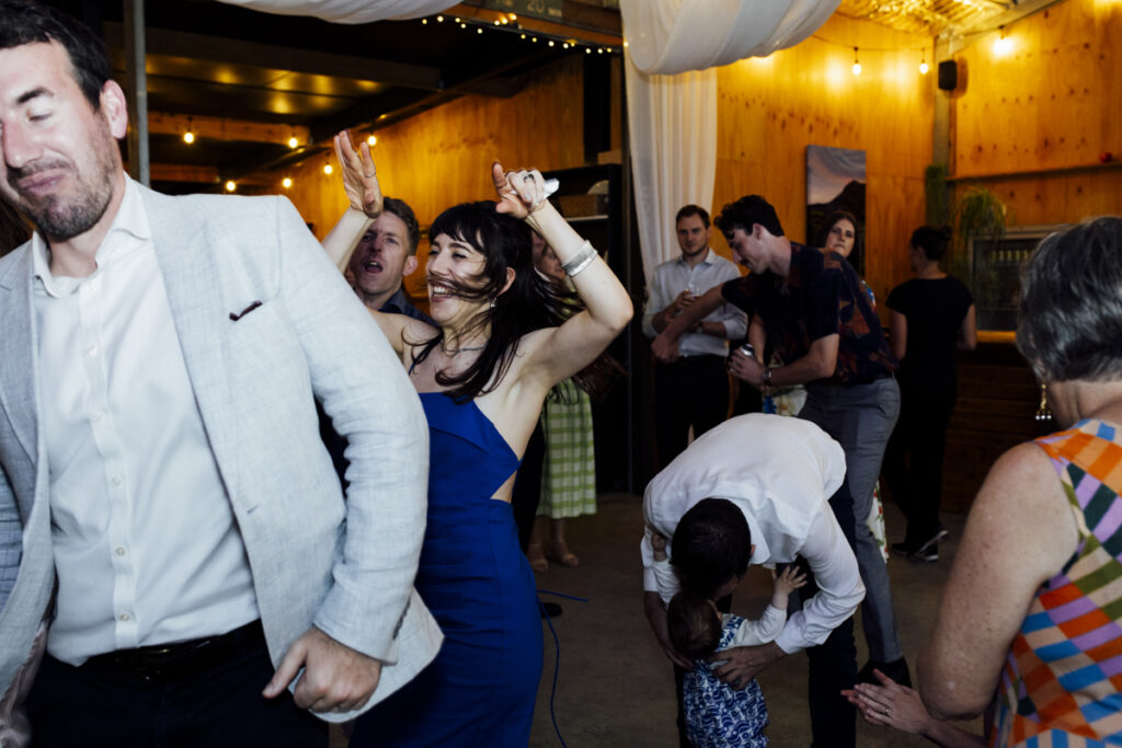Gurney Cidery Wilsons Prom wedding photography. A couple having their wedding photos taken in Gurney Cidery, that are happy and laughing. Dancing on the dance floor