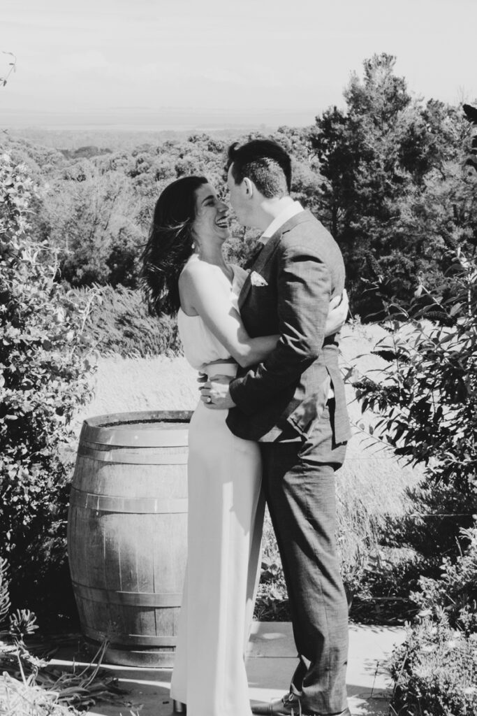 Gurney Cidery Wilsons Prom wedding photography. A couple having their wedding photos taken in Gurney Cidery, that are happy and laughing.