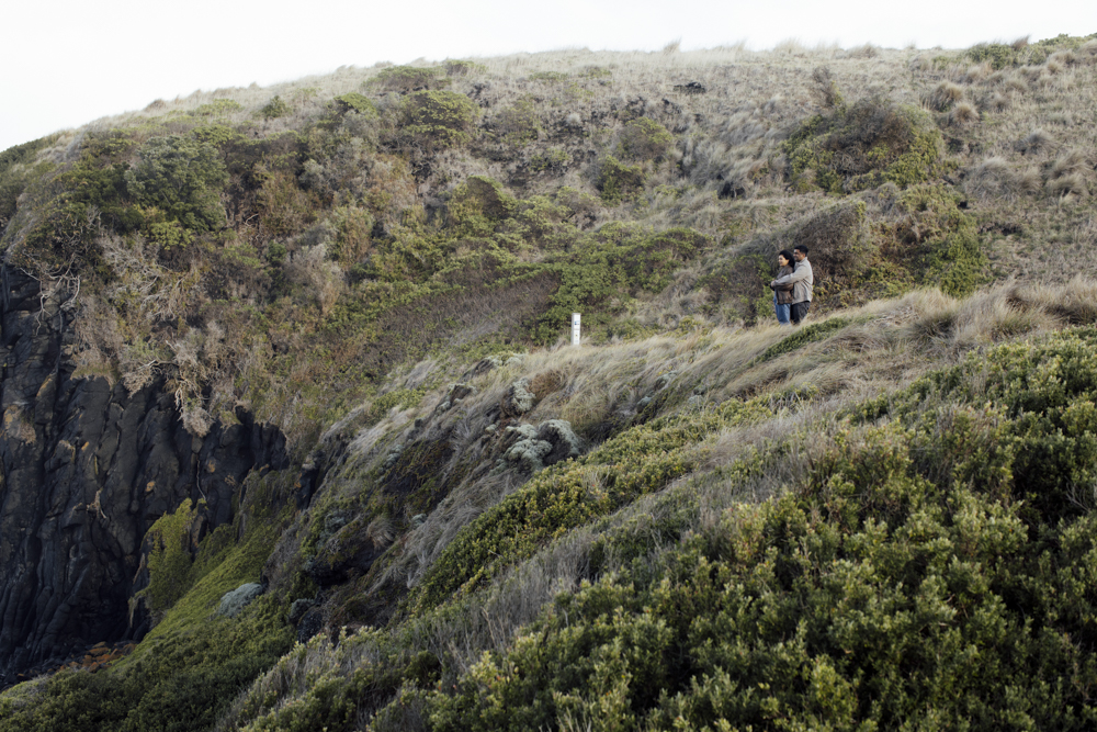 Pre-wedding photoshoot Melbourne in Flinders a couple laughing and hugging