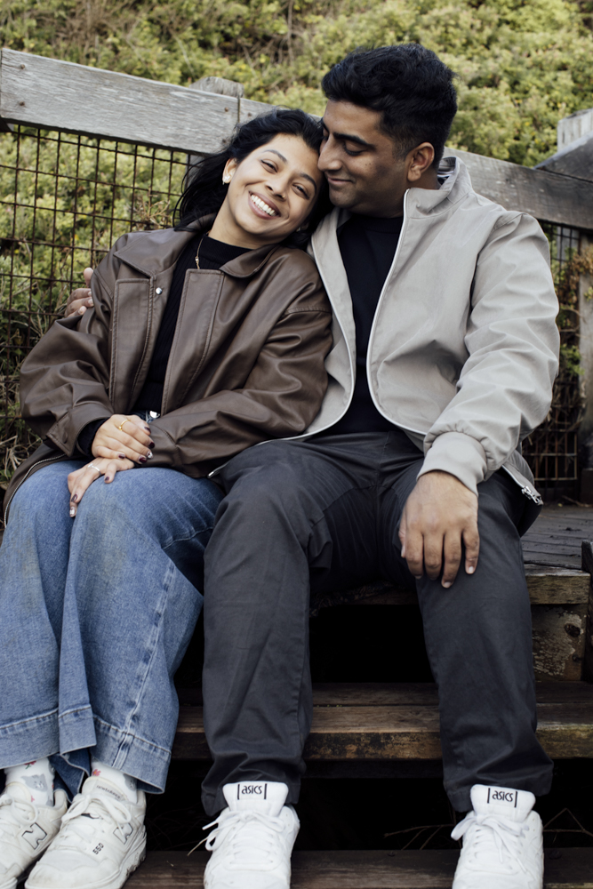 Pre-wedding photoshoot Melbourne in Flinders a couple laughing and hugging
