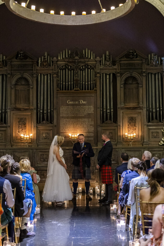 Edinburgh wedding photographer candid. A couple having their wedding ceremony in the Ghillie Dhu