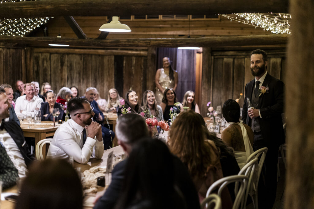 Emu Bottom Homestead wedding photography. Macedon Ranges Wedding photographer. a wedding reception the woolshed at Emu bottom homestead. Guests dancing.