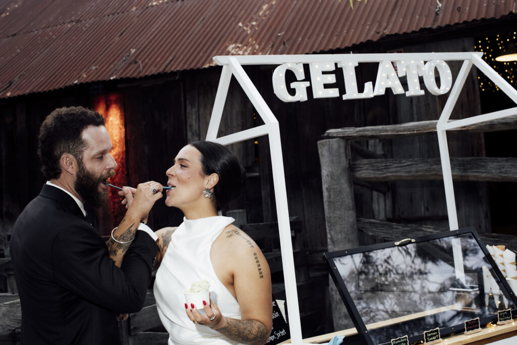 a bride and groom eating gelato at Emu Bottom homestead. Macedon Ranges wedding photographer
