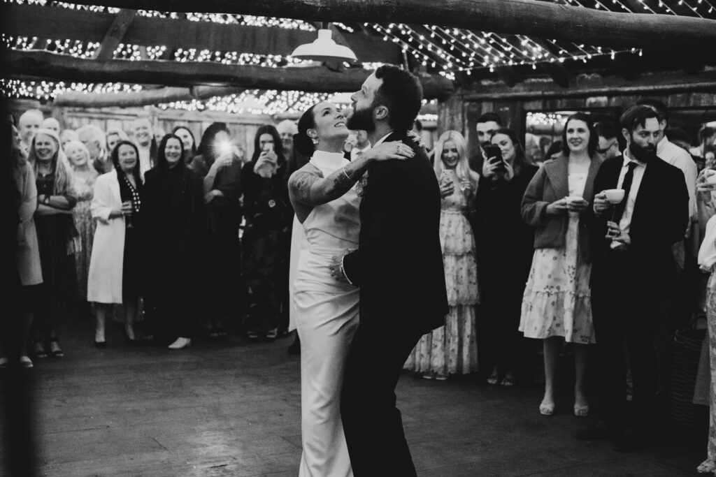 Emu Bottom Homestead wedding photography. Macedon Ranges Wedding photographer. a wedding reception the woolshed at Emu bottom homestead. Guests dancing.