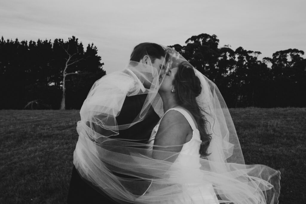 Macedon Ranges wedding photography. Bride and groom on top of a hill at Paramoor Winery with a Macedon Ranges Wedding photographer.