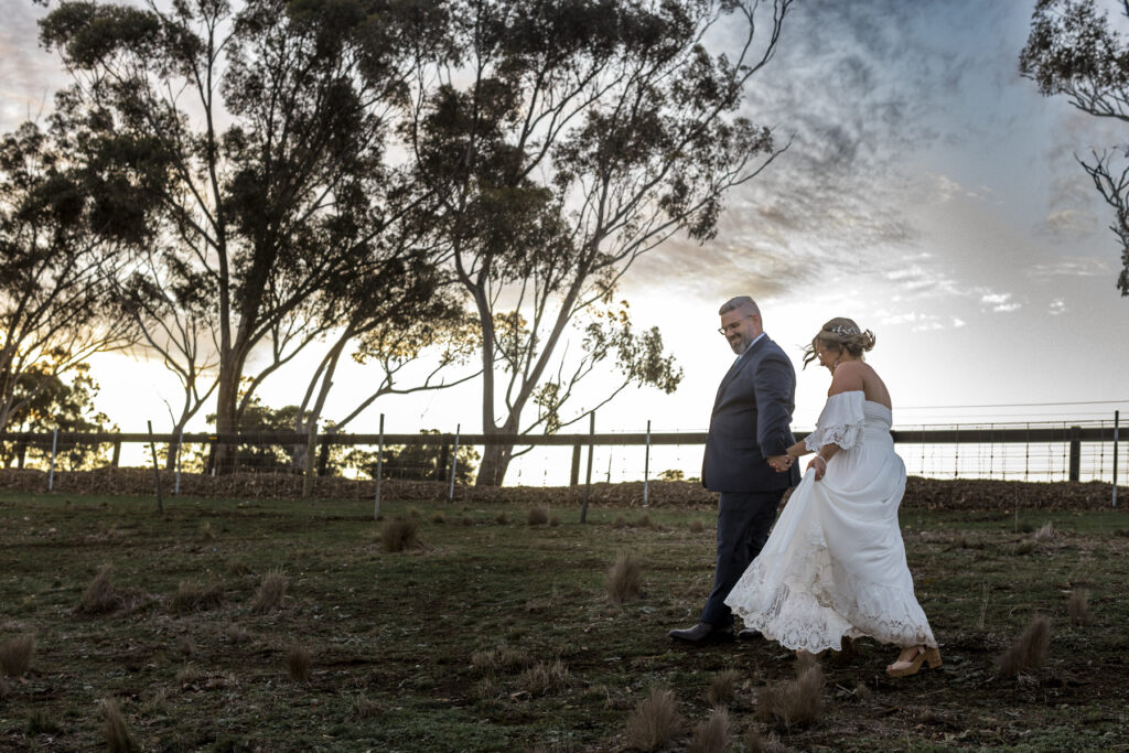 Warrawong estate wedding. Macedon Ranges Wedding photographer. Bride and Groom having photos taken at golden hour. Golden hour light in Macedon Ranges.