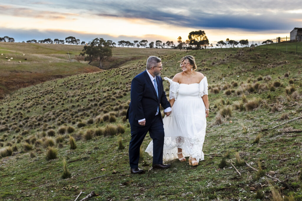 Warrawong estate wedding. Macedon Ranges Wedding photographer. Bride and Groom having photos taken at golden hour. Golden hour light in Macedon Ranges.