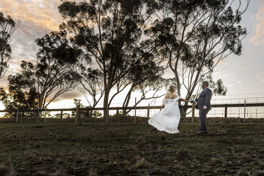 Warrawong estate wedding. Macedon Ranges Wedding photographer. Bride and Groom having photos taken at golden hour. Golden hour light in Macedon Ranges.