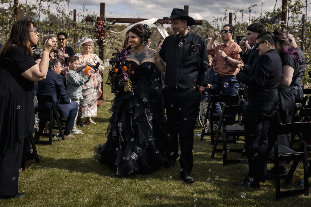 Walking down the aisle at DV Cider. Macedon Ranges Wedding photogrphy