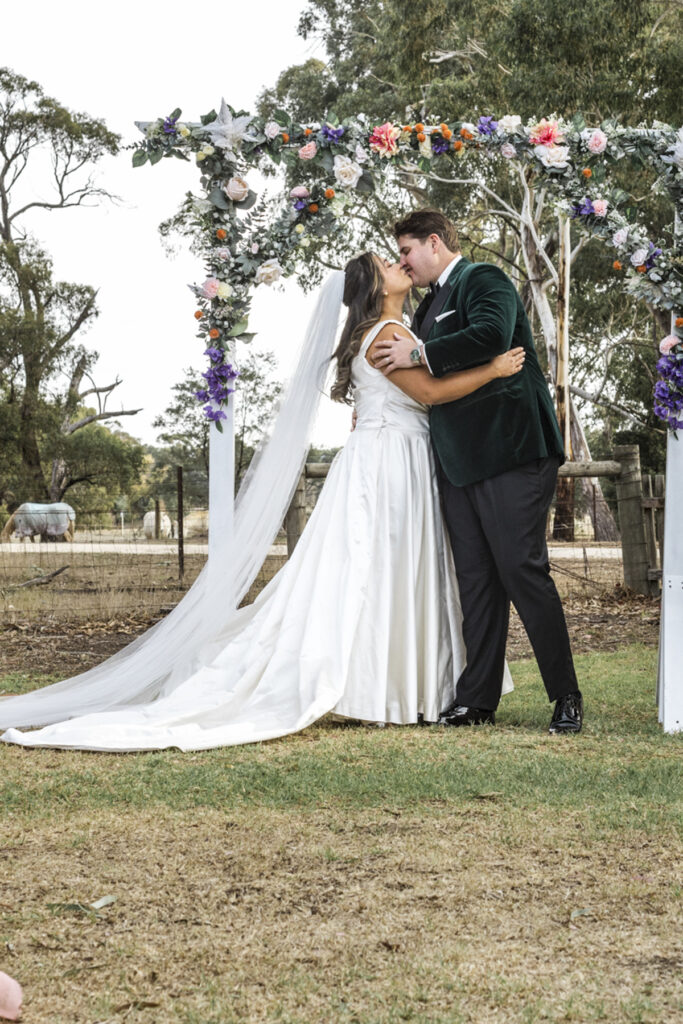 First kiss moment at Paramoor Winery in Macedon Ranges. Macedon Ranges Wedding photography