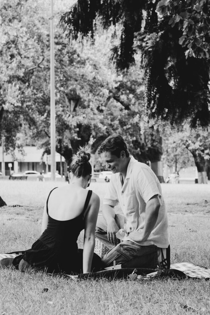 Carlton Gardens proposal. Melbourne Proposal photography. A Proposal in Melbourne. Proposal Photographer. Engagement photographer in Melbourne. a Young couple laughing and holding hands. Candid Documentary Photography 