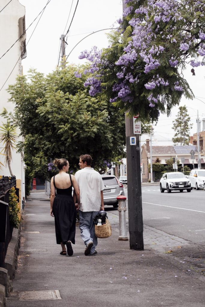 Carlton Gardens proposal. Melbourne Proposal photography. A Proposal in Melbourne. Proposal Photographer. Engagement photographer in Melbourne. a Young couple laughing and holding hands. Candid Documentary Photography 