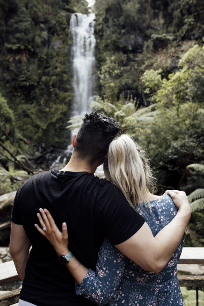 Melbourne Proposal Photographya couple hugging at Erskine Falls on Great Ocean road