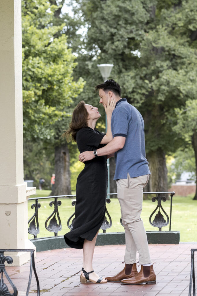 Fitzroy gardens proposal. Melbourne Proposal photography. A Proposal in Melbourne. Proposal Photographer. Engagement photographer in Melbourne. a Young couple laughing and holding hands. Candid Documentary Photography 