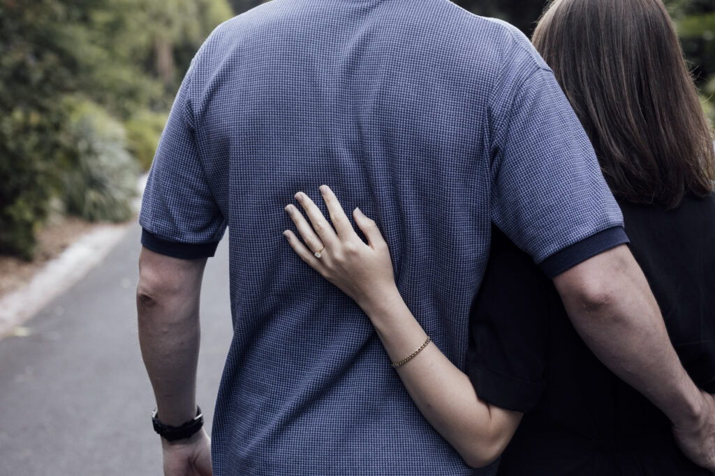 Fitzroy gardens proposal. Melbourne Proposal photography. A Proposal in Melbourne. Proposal Photographer. Engagement photographer in Melbourne. a Young couple laughing and holding hands. Candid Documentary Photography 