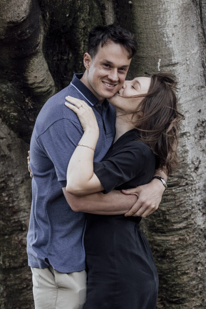 Fitzroy gardens proposal. Melbourne Proposal photography. A Proposal in Melbourne. Proposal Photographer. Engagement photographer in Melbourne. a Young couple laughing and holding hands. Candid Documentary Photography 