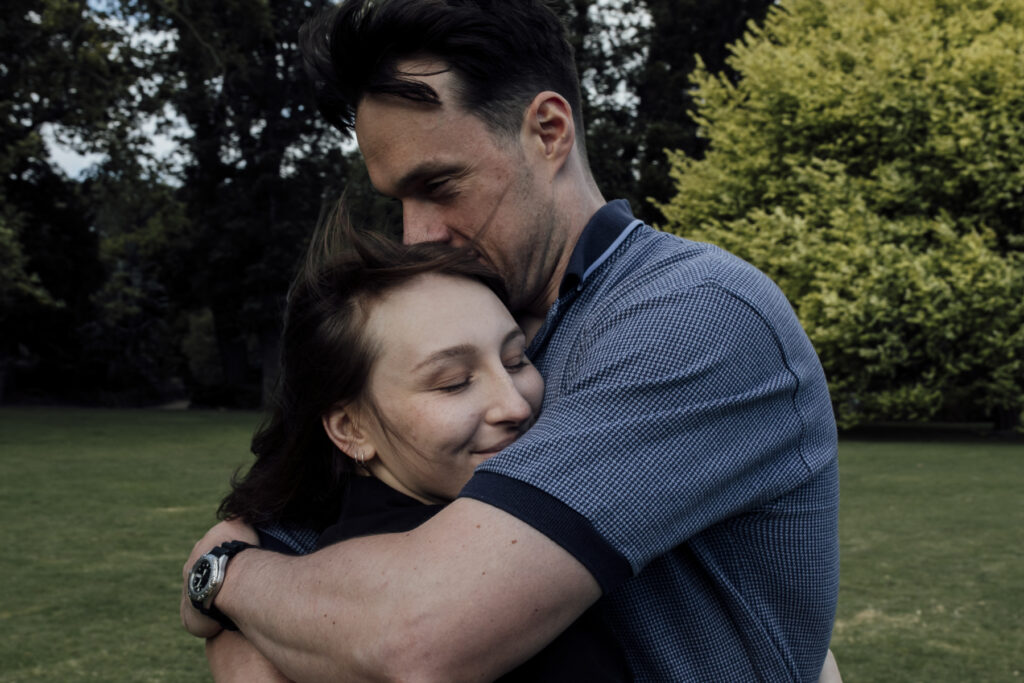 Fitzroy gardens proposal. Melbourne Proposal photography. A Proposal in Melbourne. Proposal Photographer. Engagement photographer in Melbourne. a Young couple laughing and holding hands. Candid Documentary Photography 