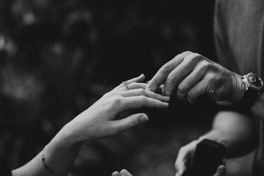 Fitzroy gardens proposal. Melbourne Proposal photography. A Proposal in Melbourne. Proposal Photographer. Engagement photographer in Melbourne. a Young couple laughing and holding hands. Candid Documentary Photography 