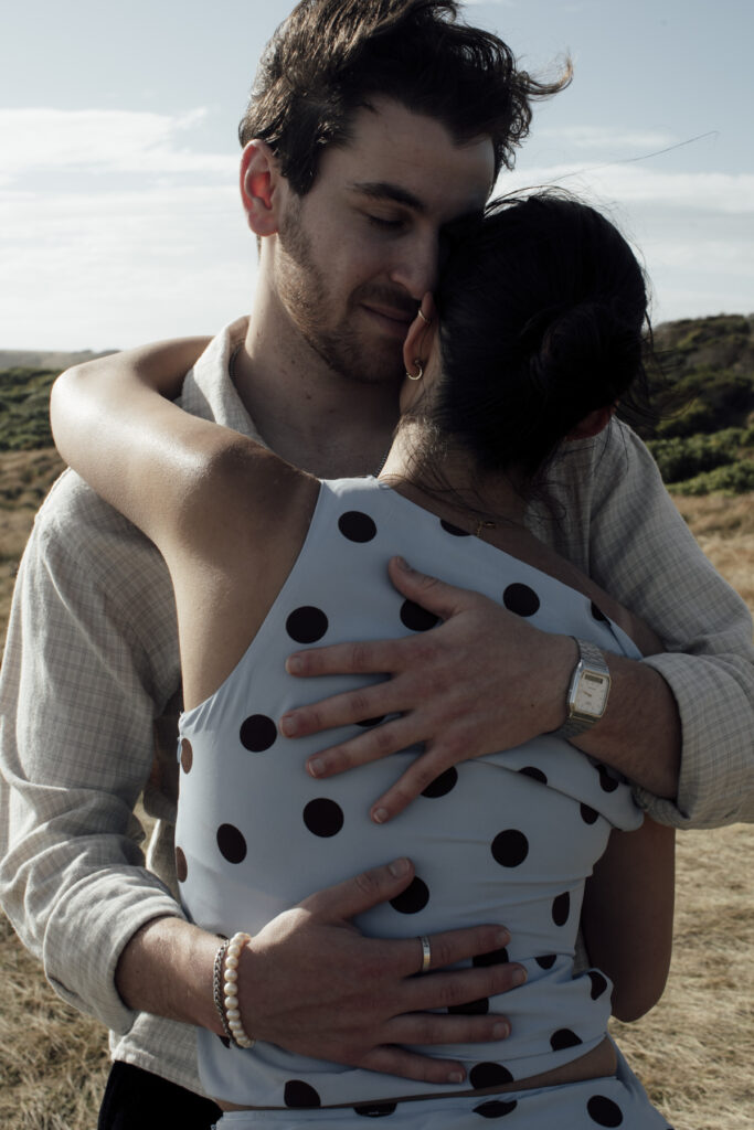 Melbourne Proposal Photography, Phillip Island proposal. Engagement photos in Phillip Isnad. Phillip Island. Proposal in Melbourne. Cinimatic photography. Polka dot Dress