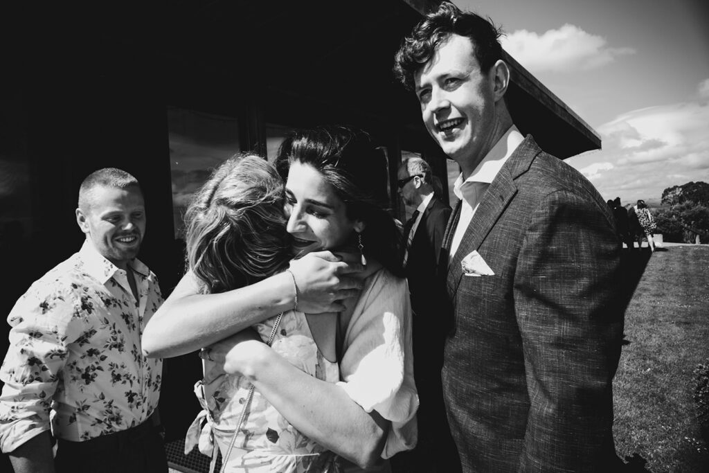 Gurneys' Cider Wedding black and white photo people hugging