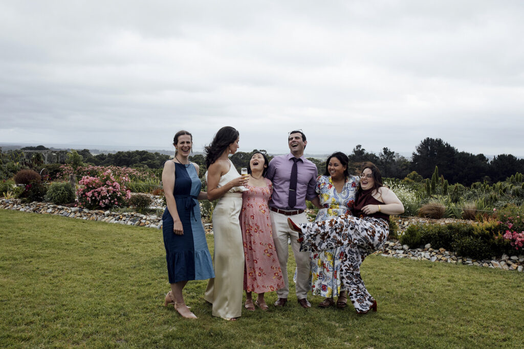 A wedding reception at Gurneys' cider, people are laughing and dancing.