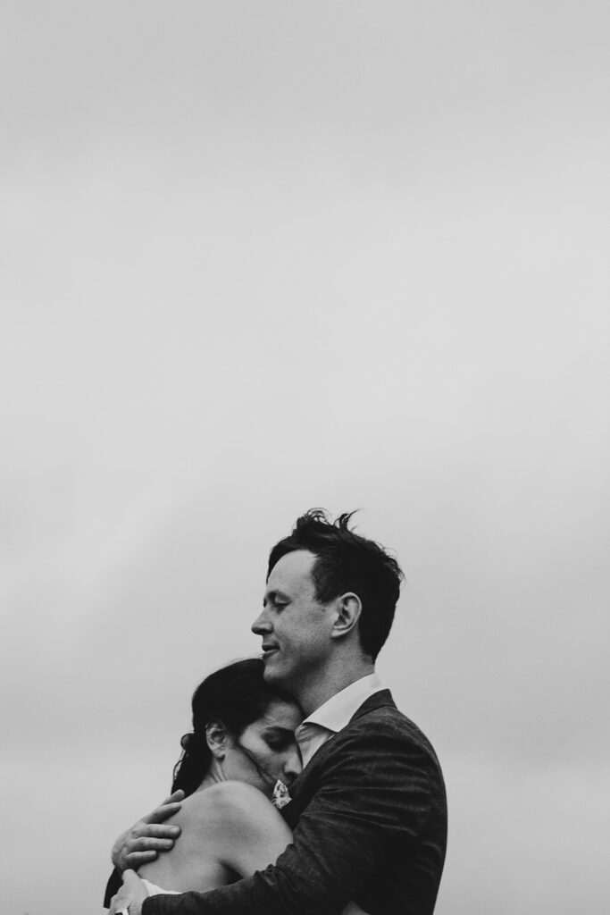 Black and white motion image of a couple at Gurneys' Cider, dancing, embracing spinning.