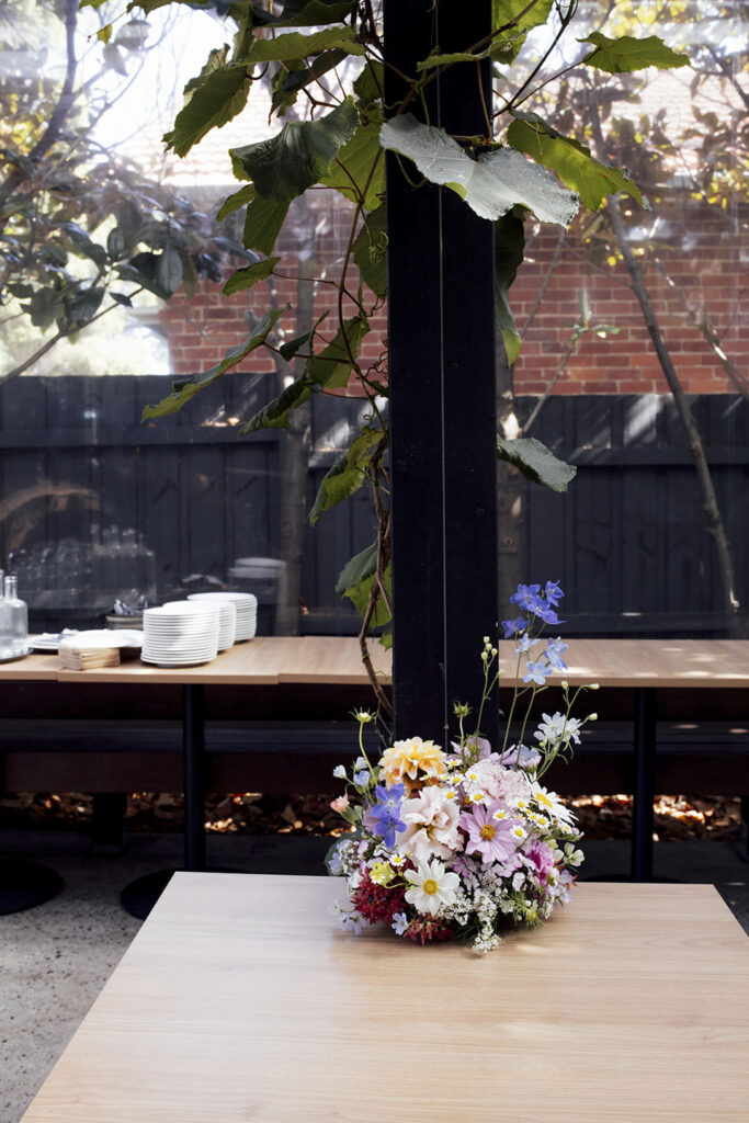 Wedding reception at the village Grae in Kew in the courtyard. The Magic of a Wine Bar Wedding in Melbourne