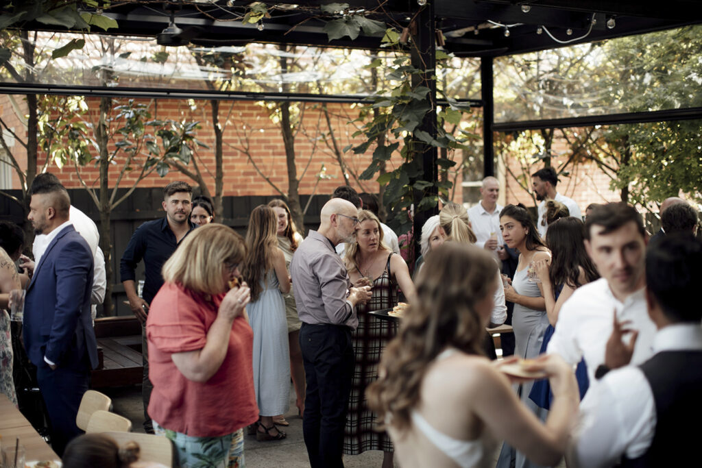Wedding reception at the village Grae in Kew in the courtyard. The Magic of a Wine Bar Wedding in Melbourne