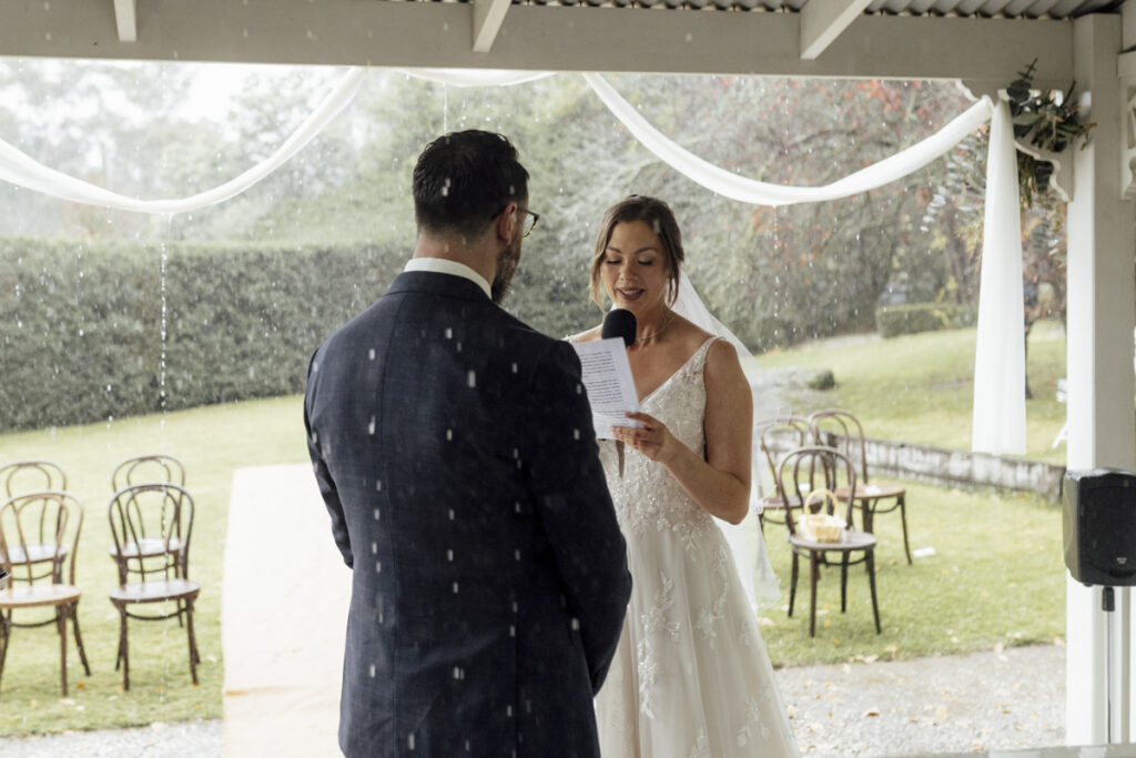 What to do if it rains on your wedding day? a beautiful rainy colour photo of a rainy ceremony